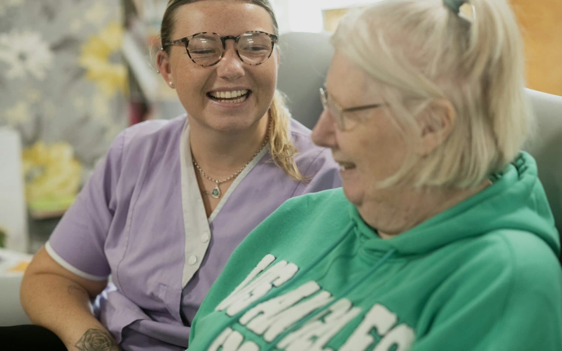 Carer talking with a resident – healthcare