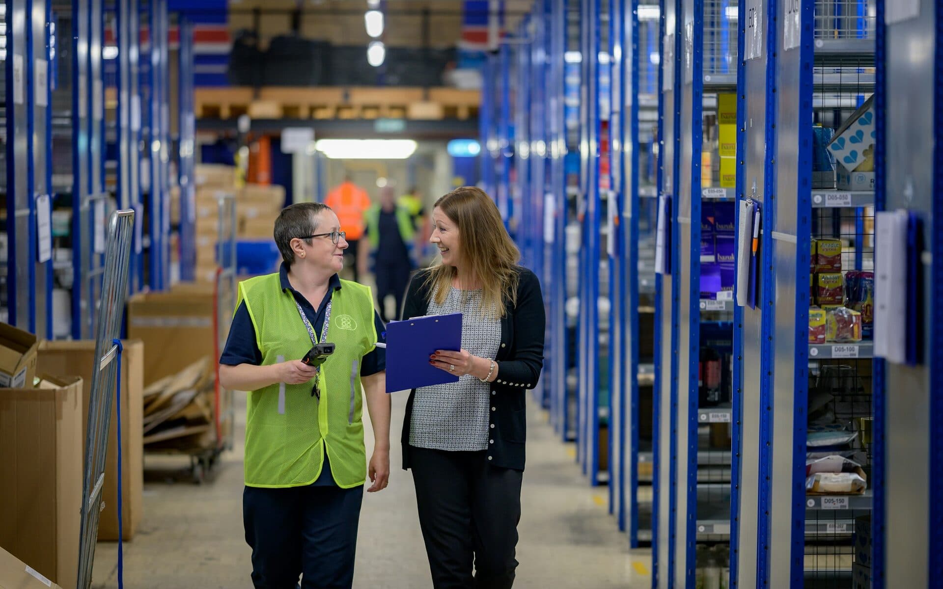 Dispatcher and colleague in a warehouse – logistics professionals